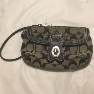 Black and grey Coach Wristlet